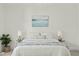 Primary bedroom featuring a calming lake painting, bedside lamps, and plants at 10040 Ward, Chapel Hill, NC 27517