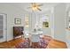 Cozy dining room with a colorful rug, modern white chairs, and hardwood floors at 10040 Ward, Chapel Hill, NC 27517