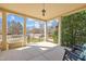 Spacious covered front porch offering a tranquil outdoor seating area with views of the neighborhood at 10040 Ward, Chapel Hill, NC 27517