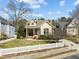 Charming home with a covered porch, neat landscaping, and a picket fence, offering warmth and curb appeal at 10040 Ward, Chapel Hill, NC 27517