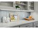 Bright kitchen with a subway tile backsplash, white countertops, and gray cabinets at 10040 Ward, Chapel Hill, NC 27517