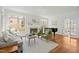 Cozy living room with a fireplace, plush seating, and large windows for natural light at 10040 Ward, Chapel Hill, NC 27517
