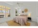 This primary bedroom features a large window with natural light and stylish decor at 10040 Ward, Chapel Hill, NC 27517