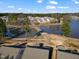 Aerial view of a waterfront community with a serene lake, walking paths, and lush greenery around the residences at 1008 Sandtrap Way, Durham, NC 27703