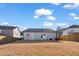 Backyard features a wooden fence, blue sky and lawn at 1008 Sandtrap Way, Durham, NC 27703