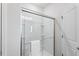 Modern bathroom featuring a glass shower enclosure and neutral color palette at 1008 Sandtrap Way, Durham, NC 27703