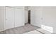 This bedroom is complete with a carpeted floor and multiple closets at 1008 Sandtrap Way, Durham, NC 27703