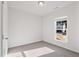 This bedroom features neutral walls, carpet flooring, and natural light from a window at 1008 Sandtrap Way, Durham, NC 27703