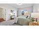 Cozy bedroom features soft carpeting and a large window for natural light at 1008 Sandtrap Way, Durham, NC 27703