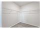Walk-in closet featuring a large storage area with shelving at 1008 Sandtrap Way, Durham, NC 27703