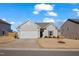 Charming single-story home with gray siding, a two-car garage, and a well-manicured front lawn at 1008 Sandtrap Way, Durham, NC 27703