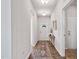 Bright hallway with modern lighting, stylish flooring, and an inviting view towards the front door at 1008 Sandtrap Way, Durham, NC 27703