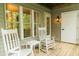 Cozy porch with rocking chairs and a small table, perfect for enjoying the outdoors at 106 Choptank Ct # B3, Cary, NC 27513