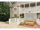 Inviting exterior view of a multi-story building with wood siding and a charming bench at 106 Choptank Ct # B3, Cary, NC 27513
