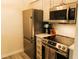 Modern kitchen featuring stainless steel appliances, granite countertops, and ample storage space, ready for cooking at 106 Choptank Ct # B3, Cary, NC 27513
