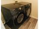Modern laundry room showcasing a black Samsung washer and dryer set at 106 Choptank Ct # B3, Cary, NC 27513