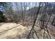 View of a spacious backyard, with tree coverage offering an ideal balance of sunlight and shade at 106 Rolling Meadows Ln, Chapel Hill, NC 27517