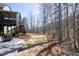 Backyard featuring a patio, direct access to a screened in porch, and lush landscaping at 106 Rolling Meadows Ln, Chapel Hill, NC 27517