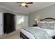 Comfortable bedroom with ensuite bathroom access features a plush bed and ceiling fan at 106 Rolling Meadows Ln, Chapel Hill, NC 27517