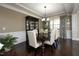 Formal dining room with dark wood table, upholstered chairs, and decorative hutch at 106 Rolling Meadows Ln, Chapel Hill, NC 27517
