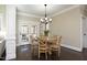 Dining room features a wood table and chairs beneath a decorative chandelier at 106 Rolling Meadows Ln, Chapel Hill, NC 27517