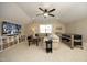 Cozy game room with a large screen television, comfortable seating and a foosball table at 106 Rolling Meadows Ln, Chapel Hill, NC 27517