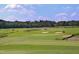 Scenic view of a golf course with manicured greens, sand traps, and a well-maintained landscape at 106 Rolling Meadows Ln, Chapel Hill, NC 27517