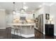 Spacious kitchen features a granite island, stainless steel appliances, and custom cabinets at 106 Rolling Meadows Ln, Chapel Hill, NC 27517