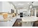 Modern kitchen with white cabinets, granite countertops, stainless steel appliances, and kitchen island at 106 Rolling Meadows Ln, Chapel Hill, NC 27517