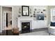 Cozy living room featuring a fireplace with built-ins and open doorway at 106 Rolling Meadows Ln, Chapel Hill, NC 27517