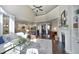 Open-concept layout with living room, fireplace, and kitchen in the background at 106 Rolling Meadows Ln, Chapel Hill, NC 27517