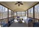Inviting screened porch with comfortable seating and views of the natural surroundings at 106 Rolling Meadows Ln, Chapel Hill, NC 27517