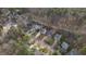 Aerial view of a home on a tree lined street with a defined property line at 107 Kingsmill Rd, Cary, NC 27511