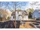 Well-maintained backyard with a fire pit area and mature trees at 107 Kingsmill Rd, Cary, NC 27511