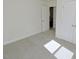 Well-lit bedroom featuring carpet, closet with double doors, and a doorway for convenient access at 108 Torain St, Hillsborough, NC 27278