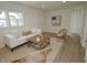 The living room is bright and airy, with a large window for natural light at 108 Torain St, Hillsborough, NC 27278