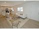 Open floor plan of a living room featuring lots of sunlight and vinyl flooring at 108 Torain St, Hillsborough, NC 27278