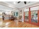 Dining area featuring hardwood floors, french doors and seamless transition to the kitchen at 109 Reton Ct, Cary, NC 27513