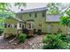 Rear exterior view showcasing a two-story house with a deck and a well-maintained yard at 109 Reton Ct, Cary, NC 27513