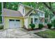 Charming home with a two-car garage, bay window, and partial front porch on a tree-lined street at 109 Reton Ct, Cary, NC 27513