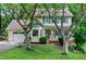 Charming yellow two-story home with blue shutters and a well-manicured lawn at 109 Reton Ct, Cary, NC 27513