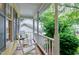 Inviting front porch with white rocking chairs, offering a relaxing outdoor space at 109 Reton Ct, Cary, NC 27513