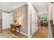 Open hallway with hardwood floors leading to dining area at 109 Reton Ct, Cary, NC 27513