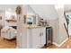 Wet bar located off the living room featuring an espresso machine and wine cooler at 109 Reton Ct, Cary, NC 27513