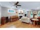 Comfortable living room featuring a fireplace, hardwood floors, and a piano at 109 Reton Ct, Cary, NC 27513