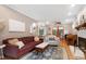 Spacious living room with a fireplace, hardwood floors and comfortable seating at 109 Reton Ct, Cary, NC 27513