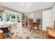 Comfortable office space featuring hardwood floors, a bay window, and built-in shelving at 109 Reton Ct, Cary, NC 27513