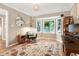 Bright office space features a bay window, hardwood floors and decorative lighting at 109 Reton Ct, Cary, NC 27513