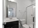 Well-lit bathroom featuring a vanity with a dark wood cabinet and a shower with glass doors at 110 Cambria Ln, Morrisville, NC 27560