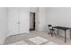 Cozy bedroom with a double door closet, neutral carpet, and a table and chair at 110 Cambria Ln, Morrisville, NC 27560